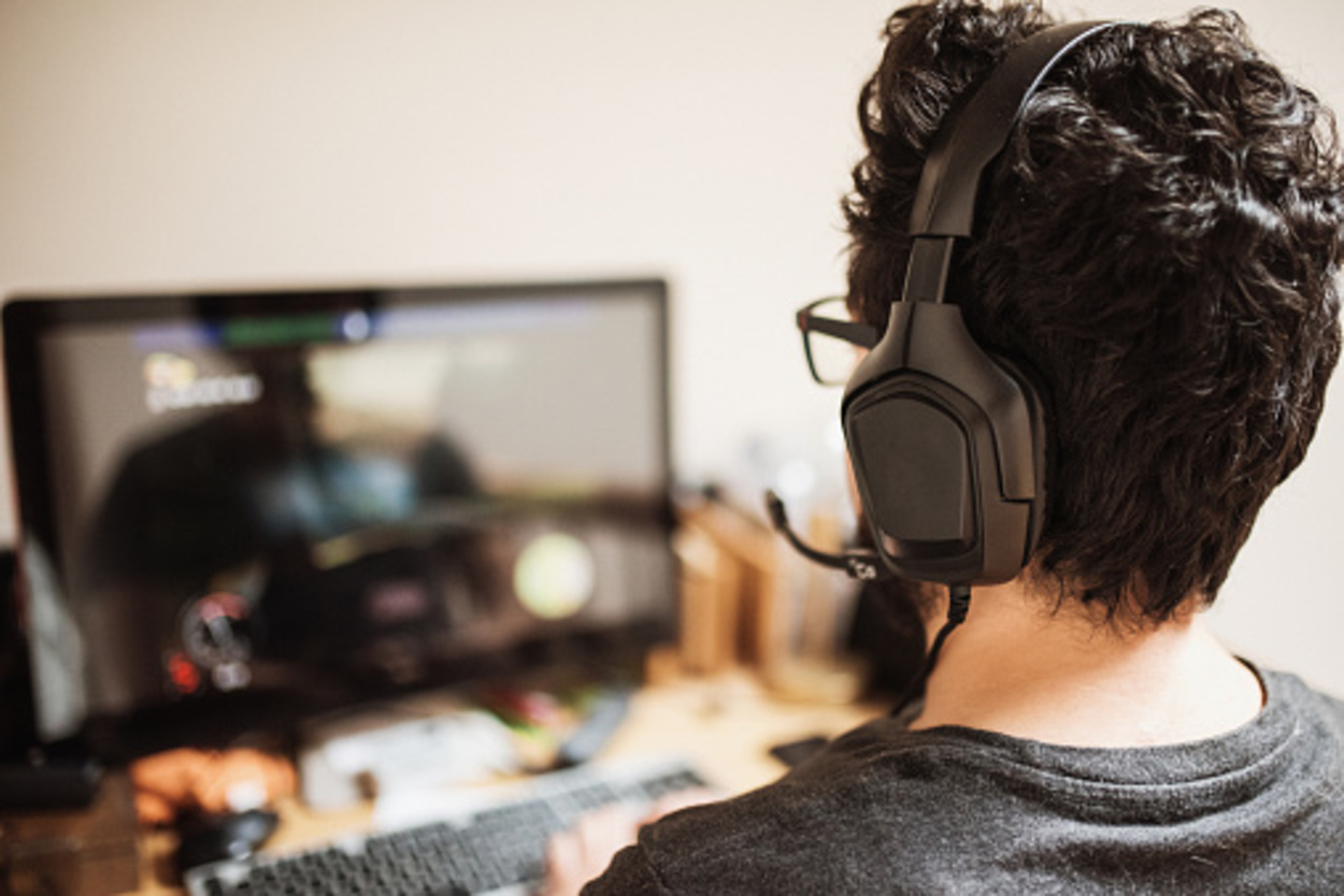 A person playing Video Games with a headset